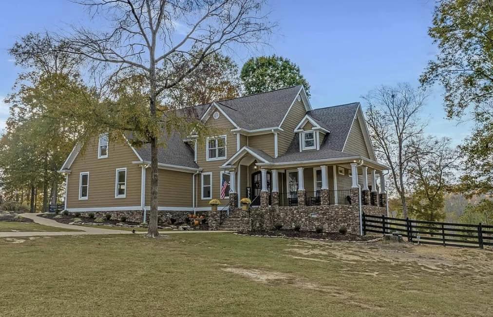 Photo of a Hardie sided home with a side wrap porch and attached garage